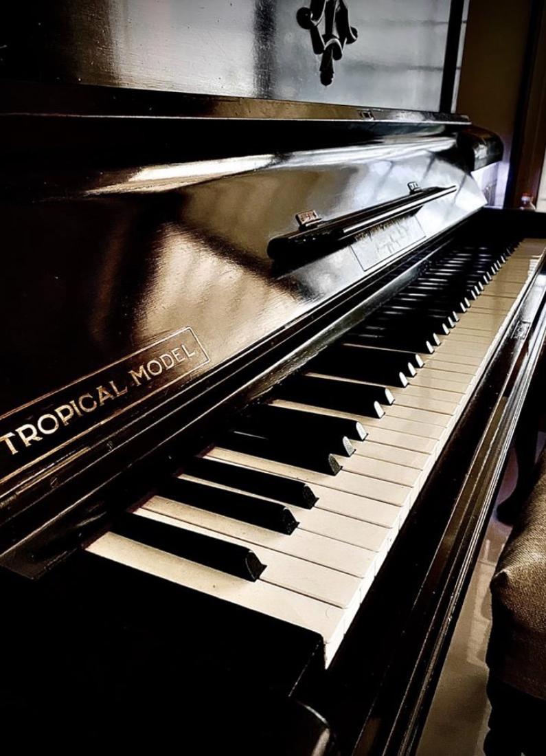 Upright piano keys in the studio