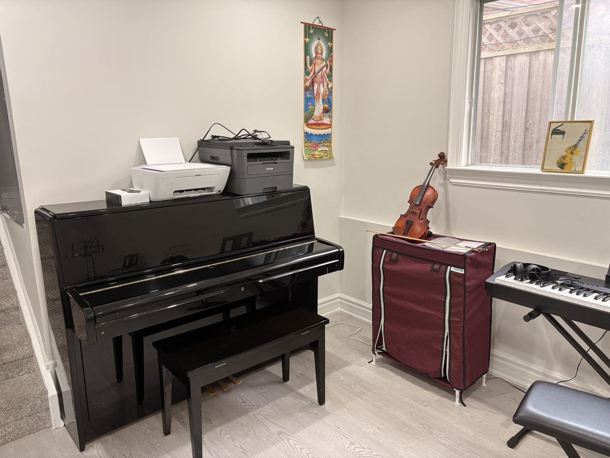 Piano and violin room: Upright piano for lessons and exam practice